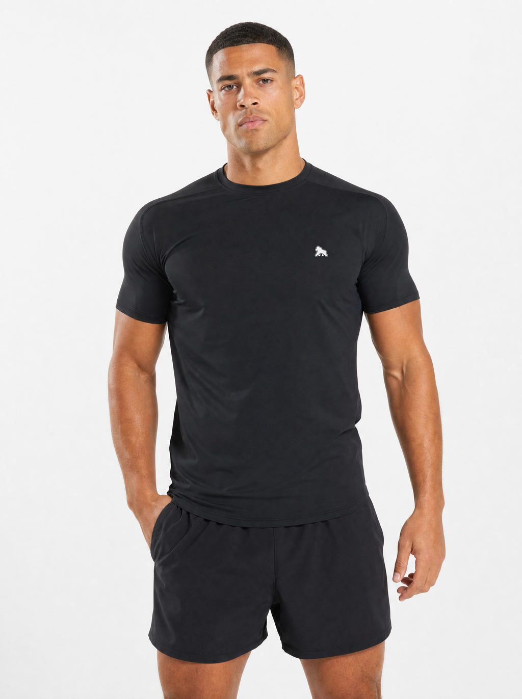 FIT APE Performance Tee in black, worn by male fitness model, front view with gorilla logo on left chest