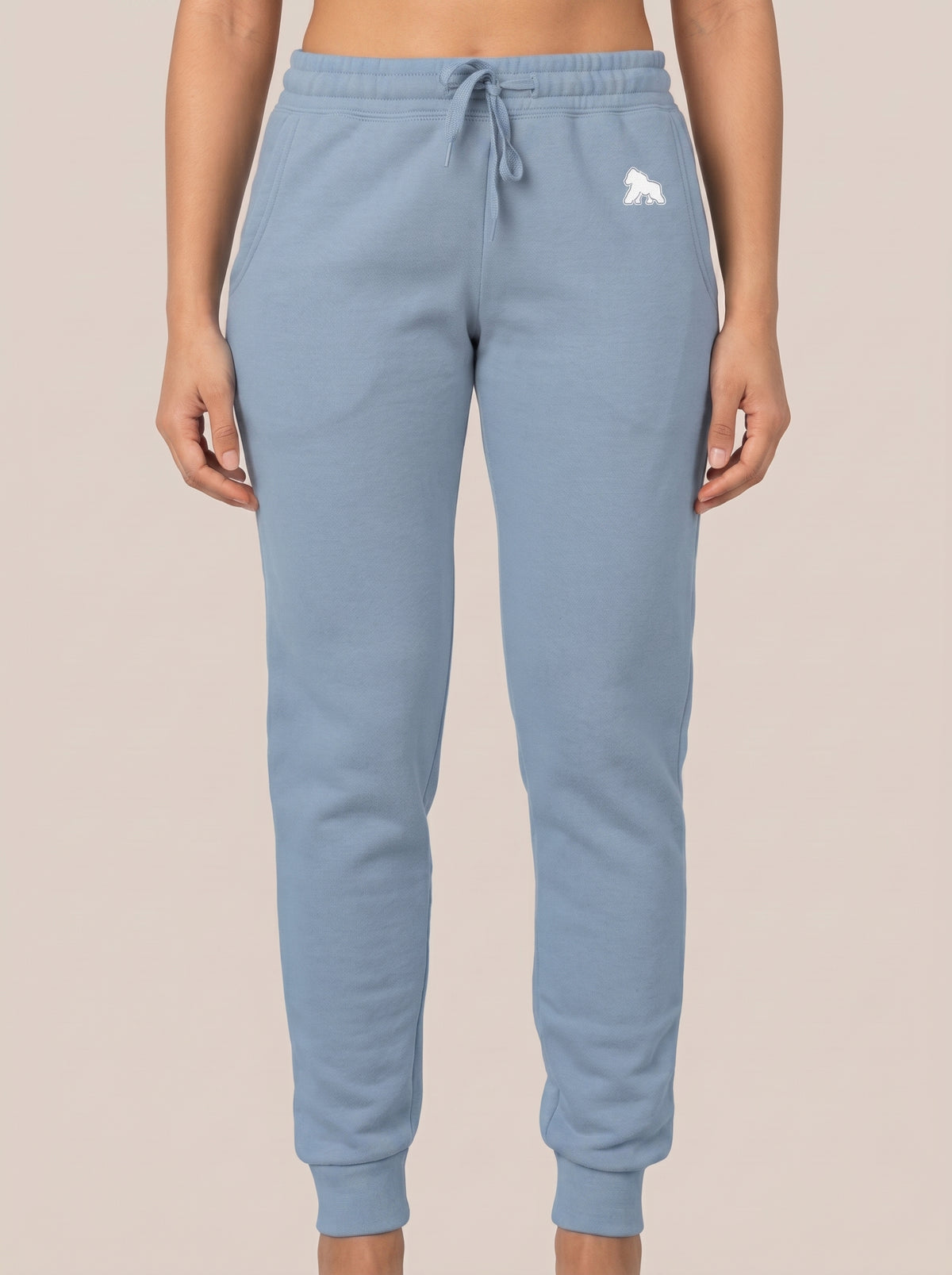 Light blue FIT APE women's drawstring sweatpants, front view on a model