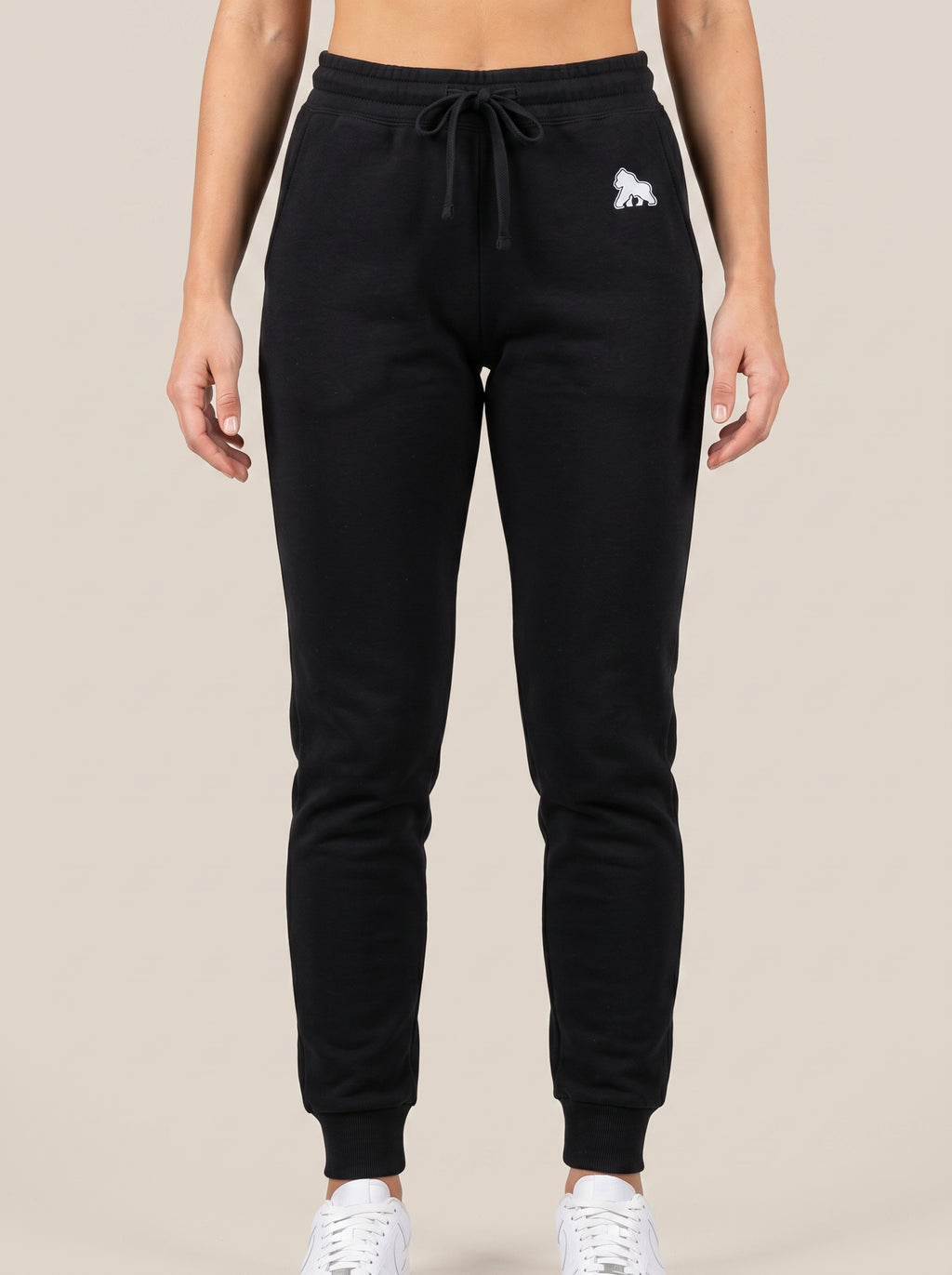 Black FIT APE women's drawstring sweatpants, front view on a model