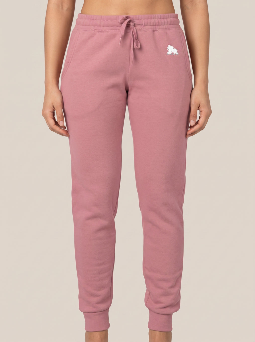 Pink FIT APE women's drawstring sweatpants, front view on a model
