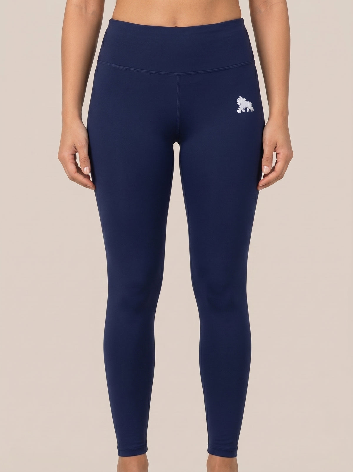 Navy FIT APE women's high-waist leggings with white hip gorilla, front view on a model
