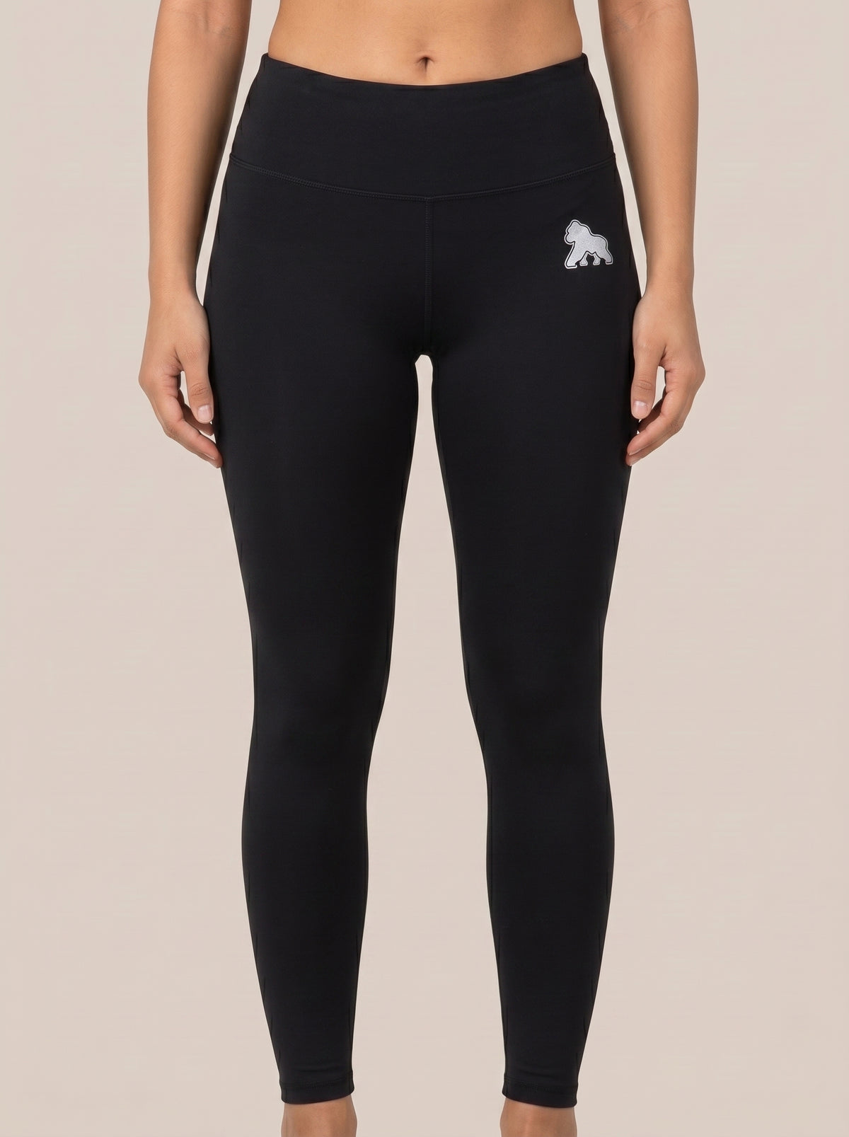 Black FIT APE women's high-waist leggings with white hip gorilla, front view on a model