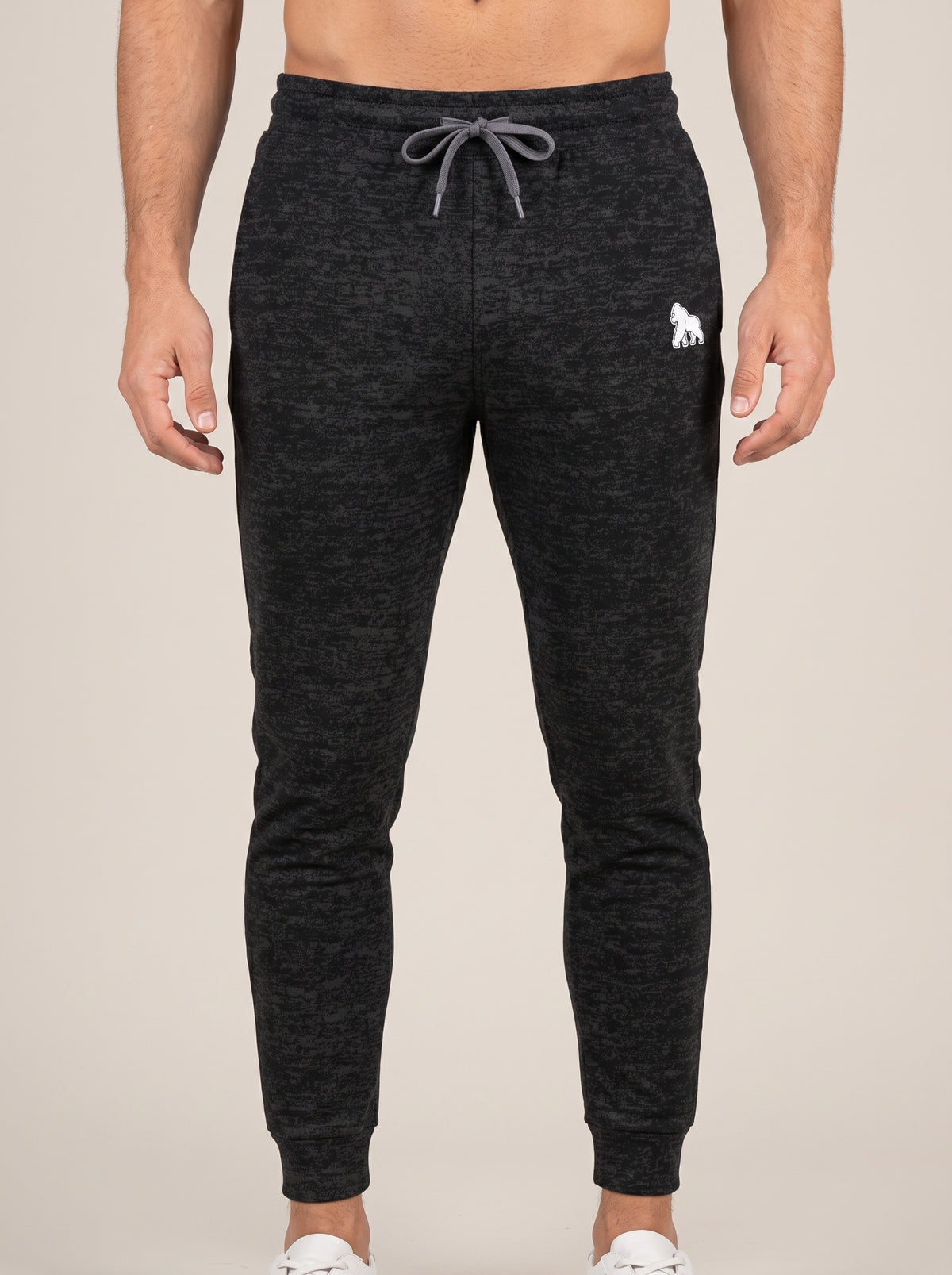 Charcoal heather FIT APE men's drawstring joggers with white hip gorilla, front view