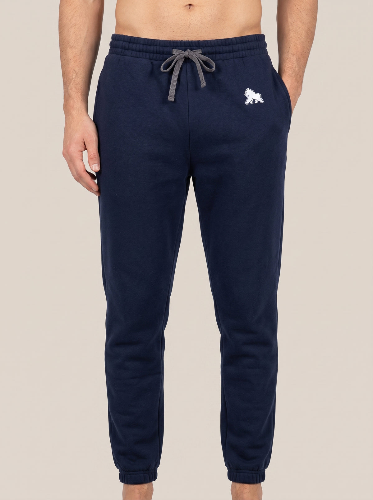 Navy FIT APE men's drawstring joggers with white hip gorilla, front view