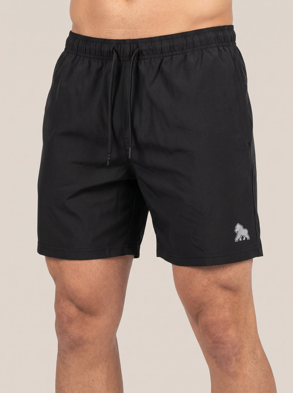 Black FIT APE men's drawstring performance shorts with white leg gorilla, front view
