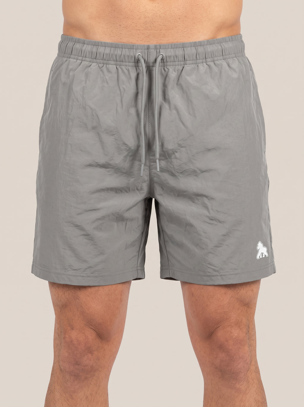 Gray FIT APE men's drawstring performance shorts with white leg gorilla, front view