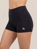 Black FIT APE women's fitted shorts with white hip gorilla, angled front view