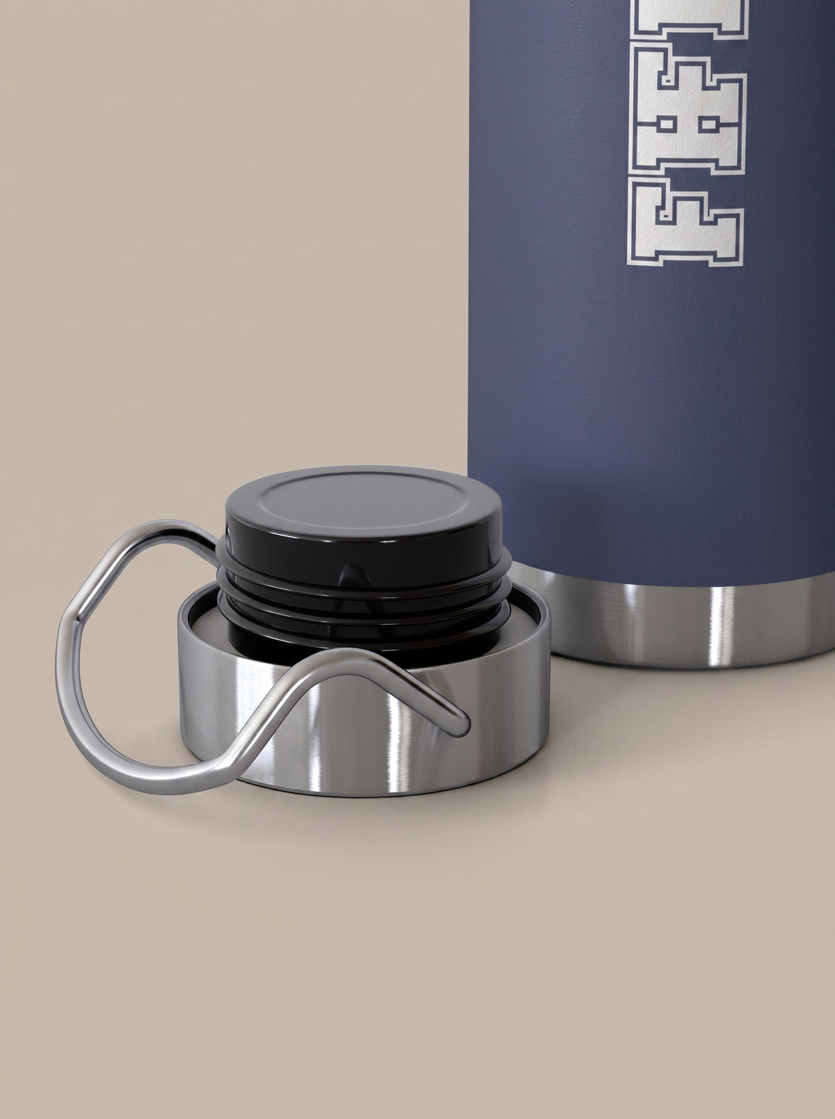 Navy FIT APE water bottle beside its removed silver cap