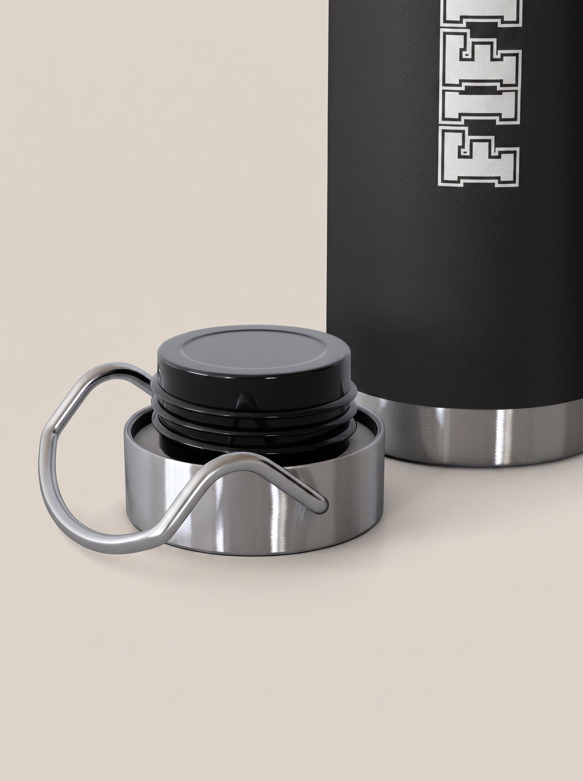 Black FIT APE water bottle beside its removed silver cap