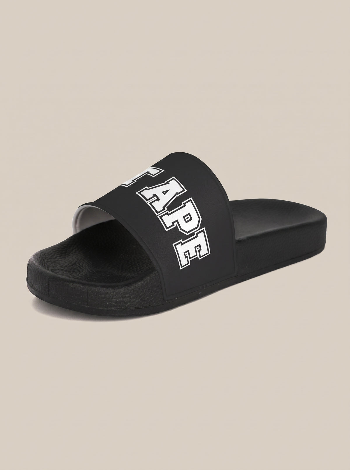Black women's FIT APE slide with white strap lettering, opposite three-quarter view