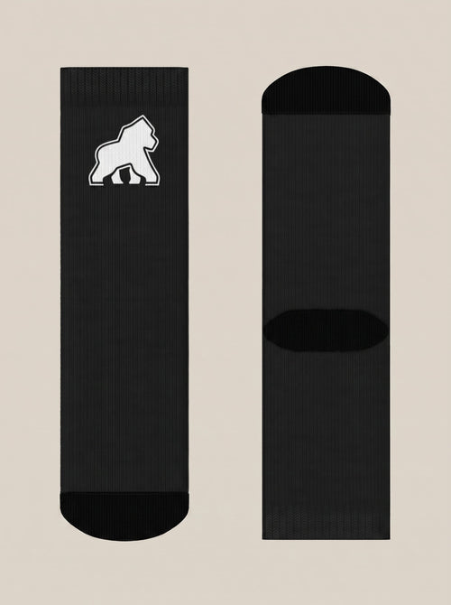 Black FIT APE crew socks laid flat, showing the white gorilla emblem and soles