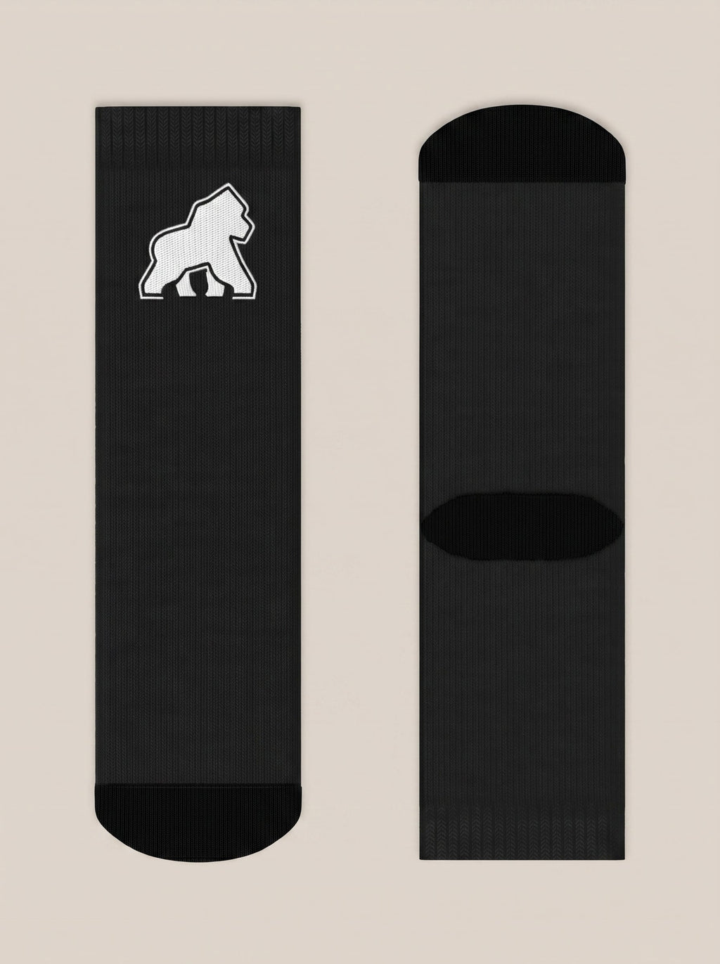 Pair of black FIT APE crew socks laid flat with white gorilla emblem
